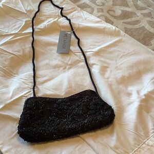 Black purse beautiful beaded on both sides.